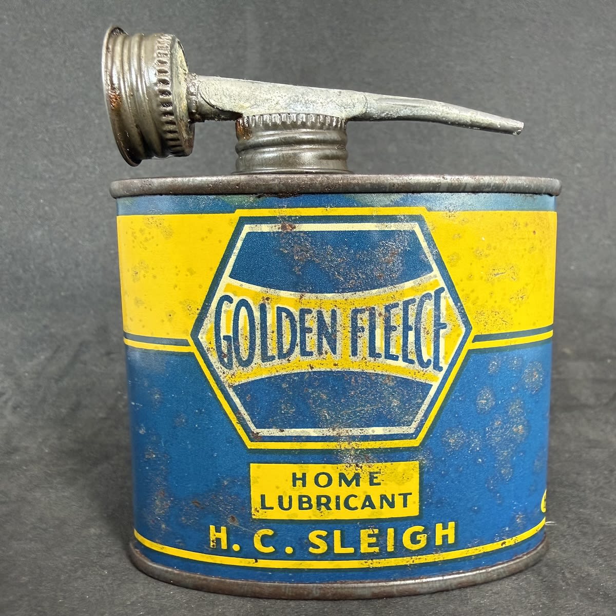 Oil Tin. Golden Fleece Lubricants. Home Lubricant. H. C. Sleigh. Hexagonal print design. Oval tin. 4 oz size.