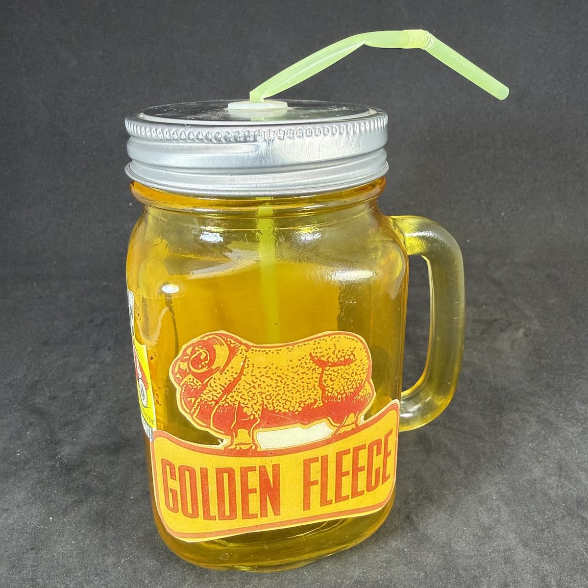 Handled Drinking glass/mug. Stuck on images for Rowley Park Speedway Torrens Rd Adelaide and a Golden Fleece logo.
