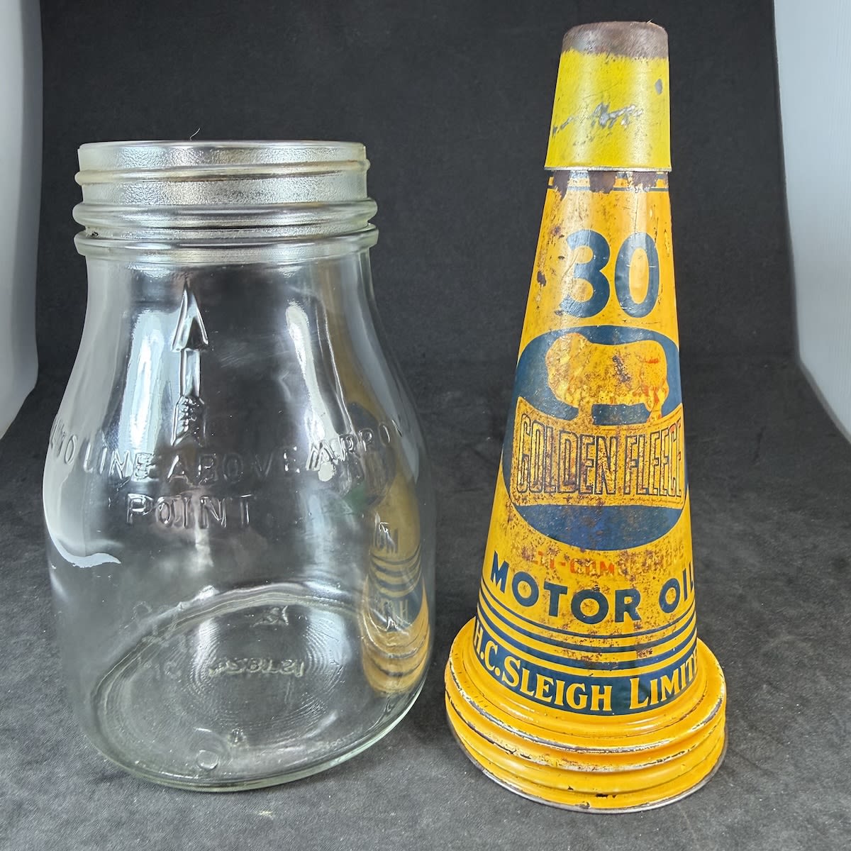 Tin oil pourer and Glass Bottle. Golden Fleece Motor Oil. H. C. Sleigh Limited. Generic Pint Bottle.