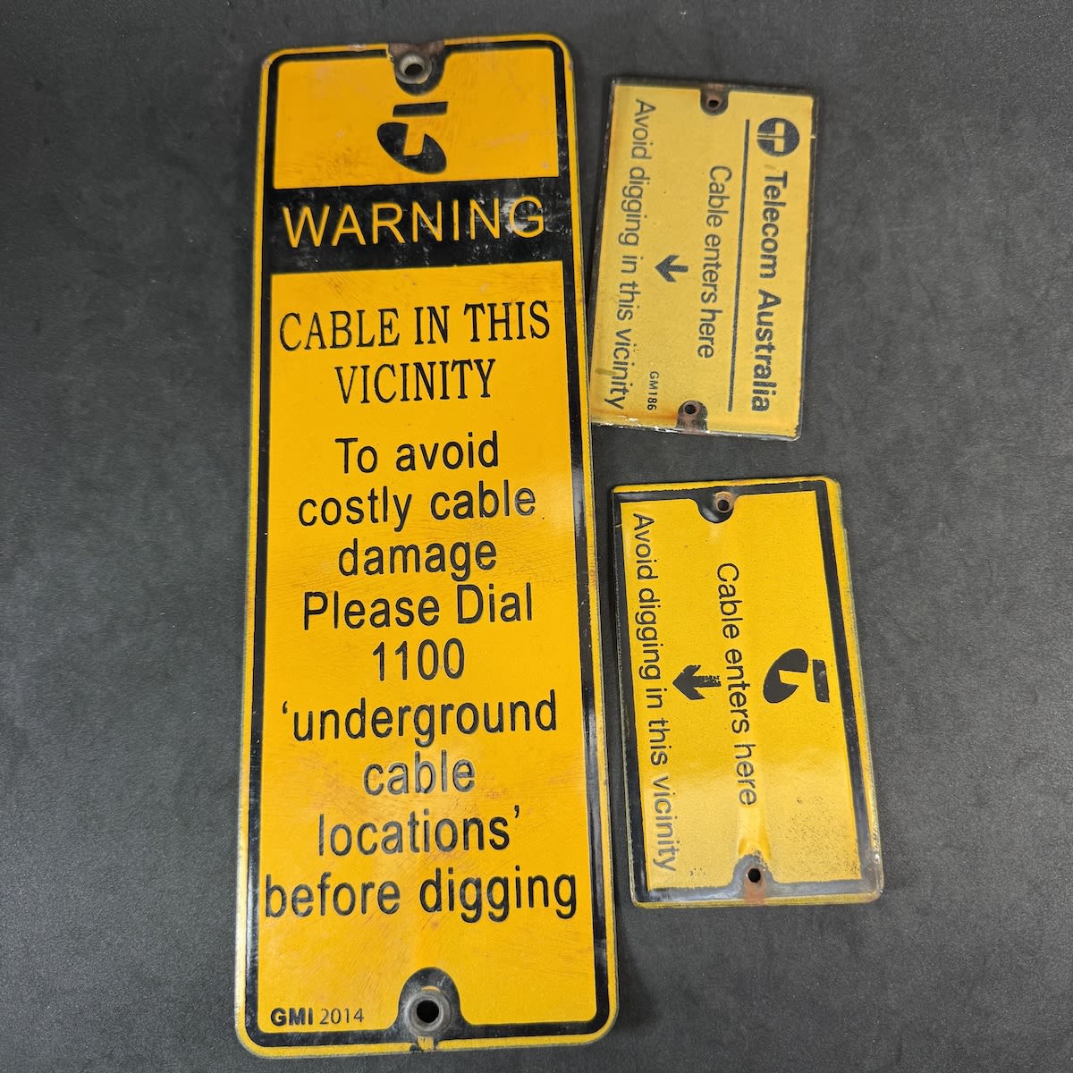 3 Small Enamel signs for Telecom Australia / Telstra. Cable warnings.