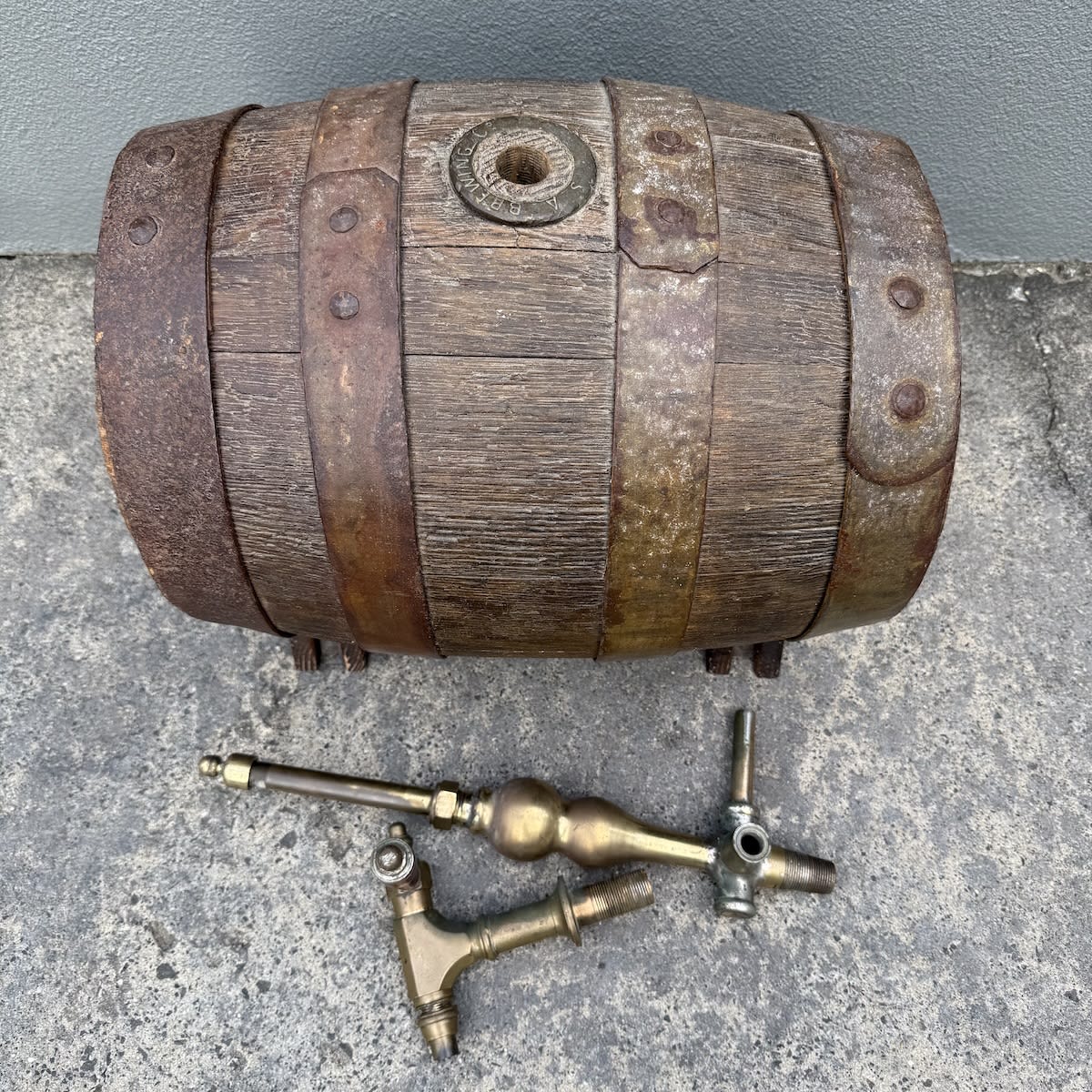Beer Barrel or Beer Keg. S. A. Brewing Co and West End Brewery brass surrounds. West End Adelaide. Brass tap and brass joiner for the top. Two wooden stands as well.