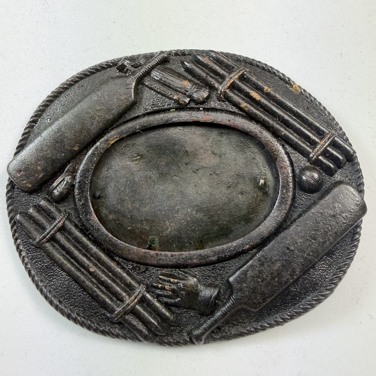 Cricket Belt Buckle / Sash Buckle. Backing piece with Stumps, Bats, Glove, Cap, pads and ball around the outside. Oval with plain oval centre that would have had another decorative piece. ? & Co Patent on the back.