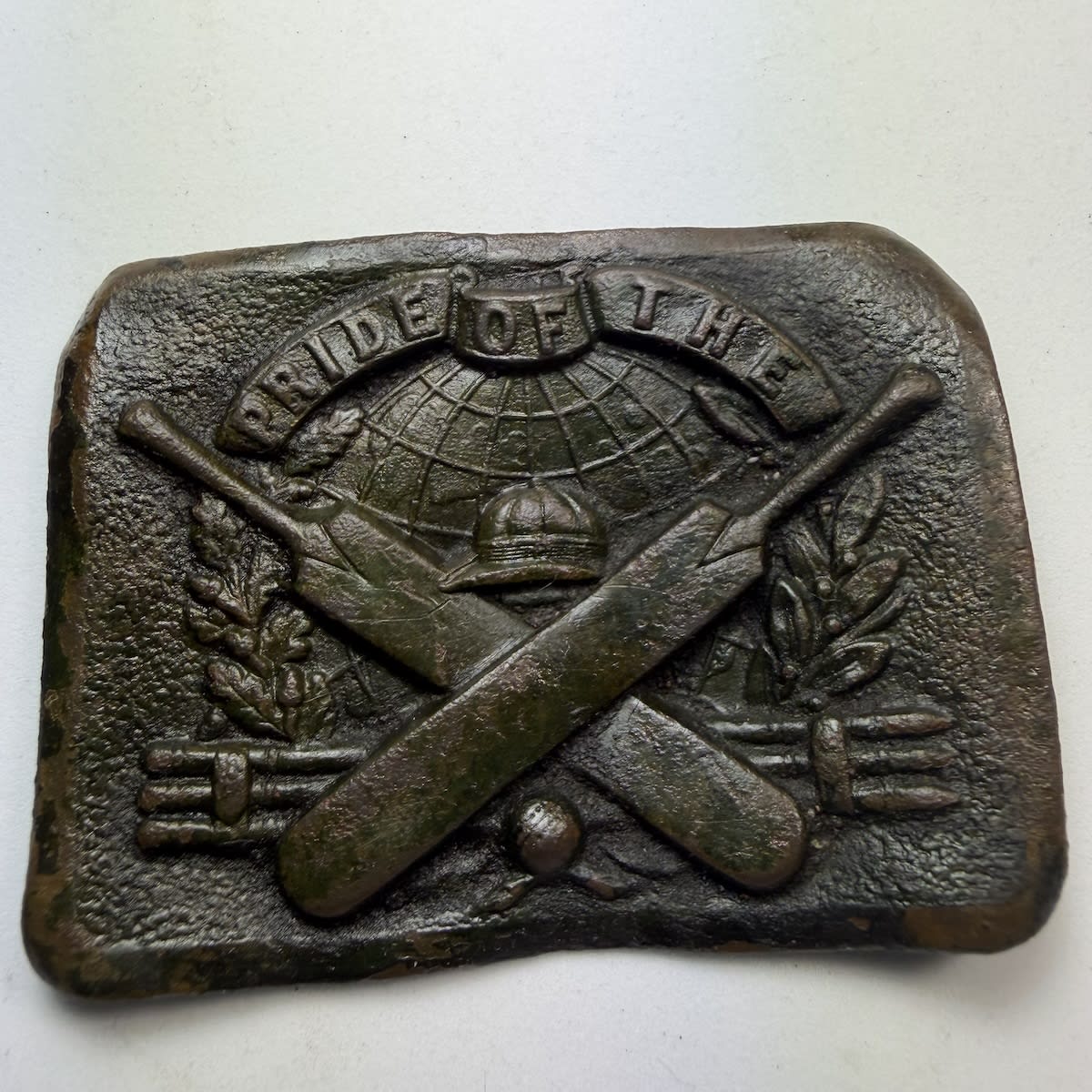 Cricket Belt Buckle / Sash Buckle. Pride of the World (with the World represented by a Globe). Cap, Crossed Bats, Stumps, Ball and a wreath.