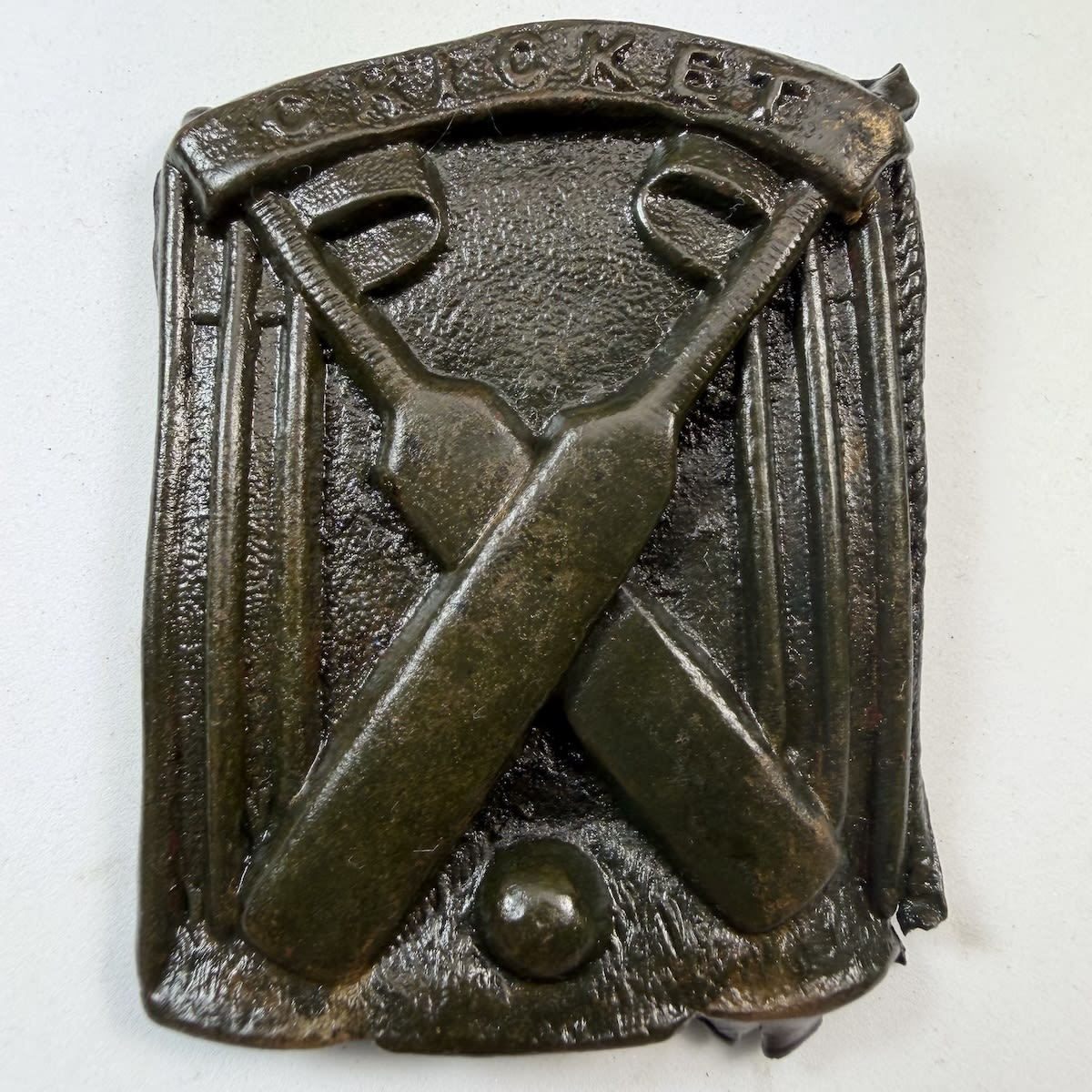 Cricket Belt Buckle / Sash Buckle. Cricket in a banner at the top. Crossed Bats, Stumps and a ball.