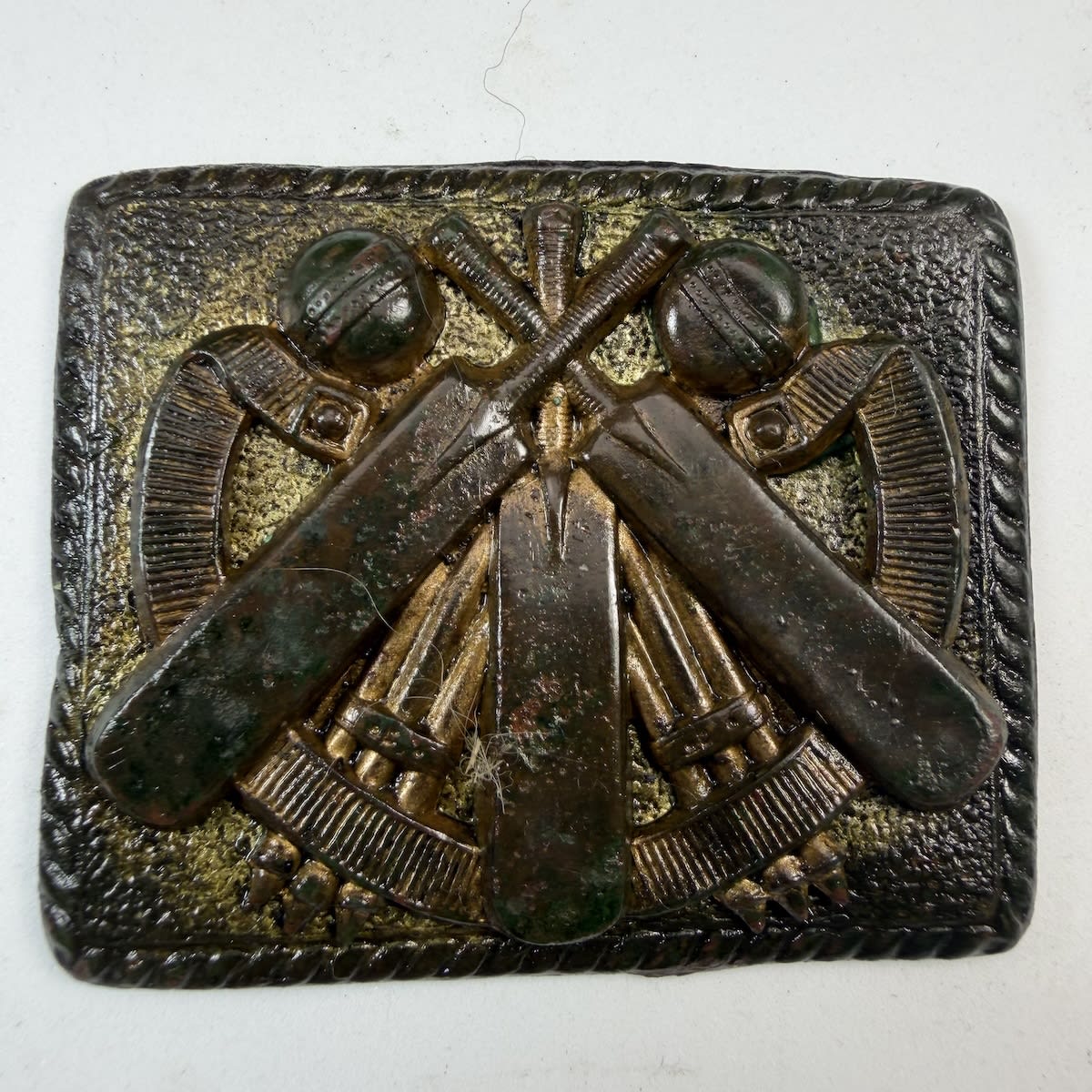Cricket Belt Buckle / Sash Buckle. A belt around Three bats, two sets of stumps and two balls.