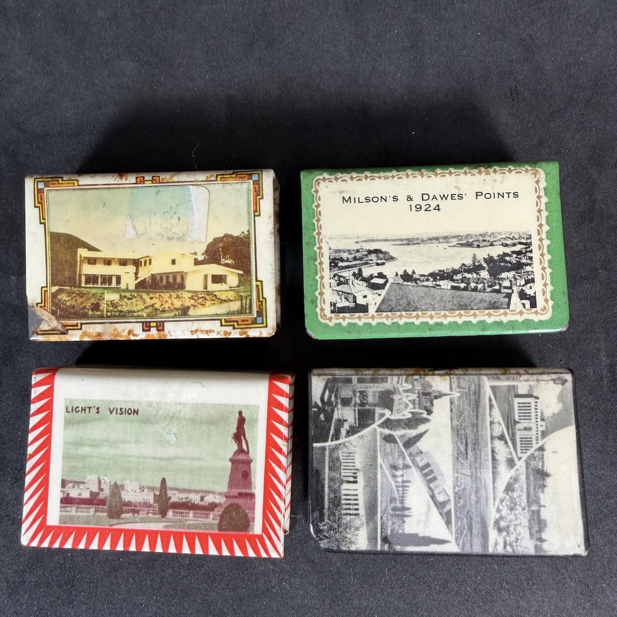 4 Matchbox Holders: Souvenir of Canberra; Adelaide; Eaglehawk Neck Tasmania; Sydney Harbour Bridge.