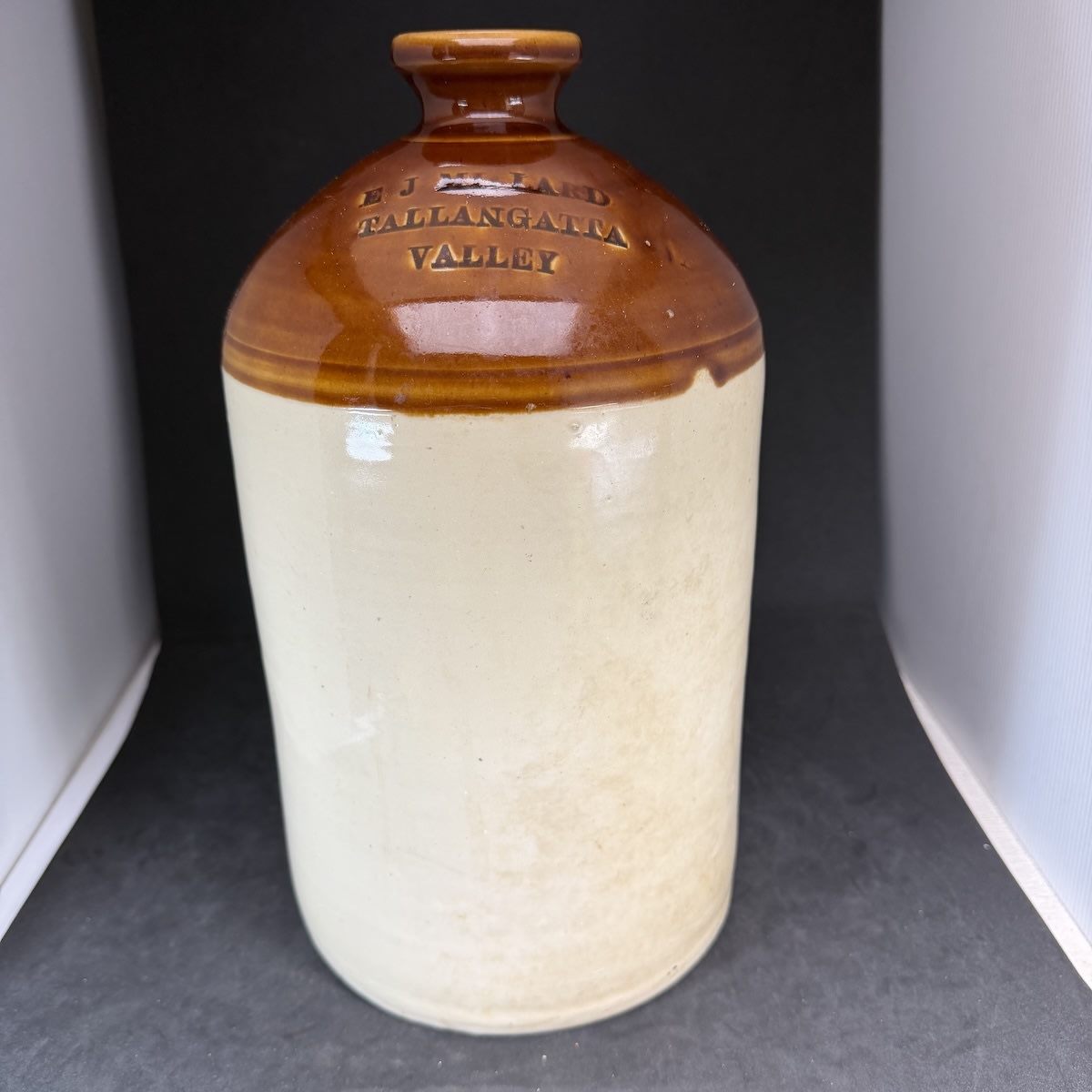 Demijohn. E J Millard, Tallangatta Valley. Impressed.Tan Top. One Gallon. (Victoria)