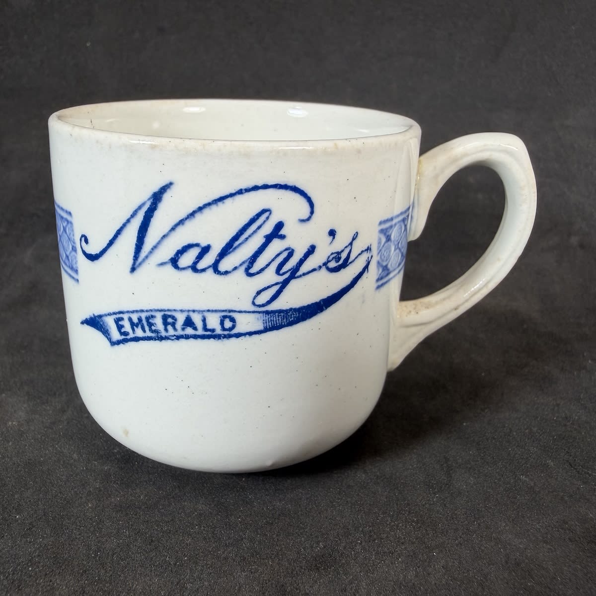 Hotelware Coffee Cup. Nalty's Emerald. Grindley. Dated 1937. Fancy blue print. (Queensland)
