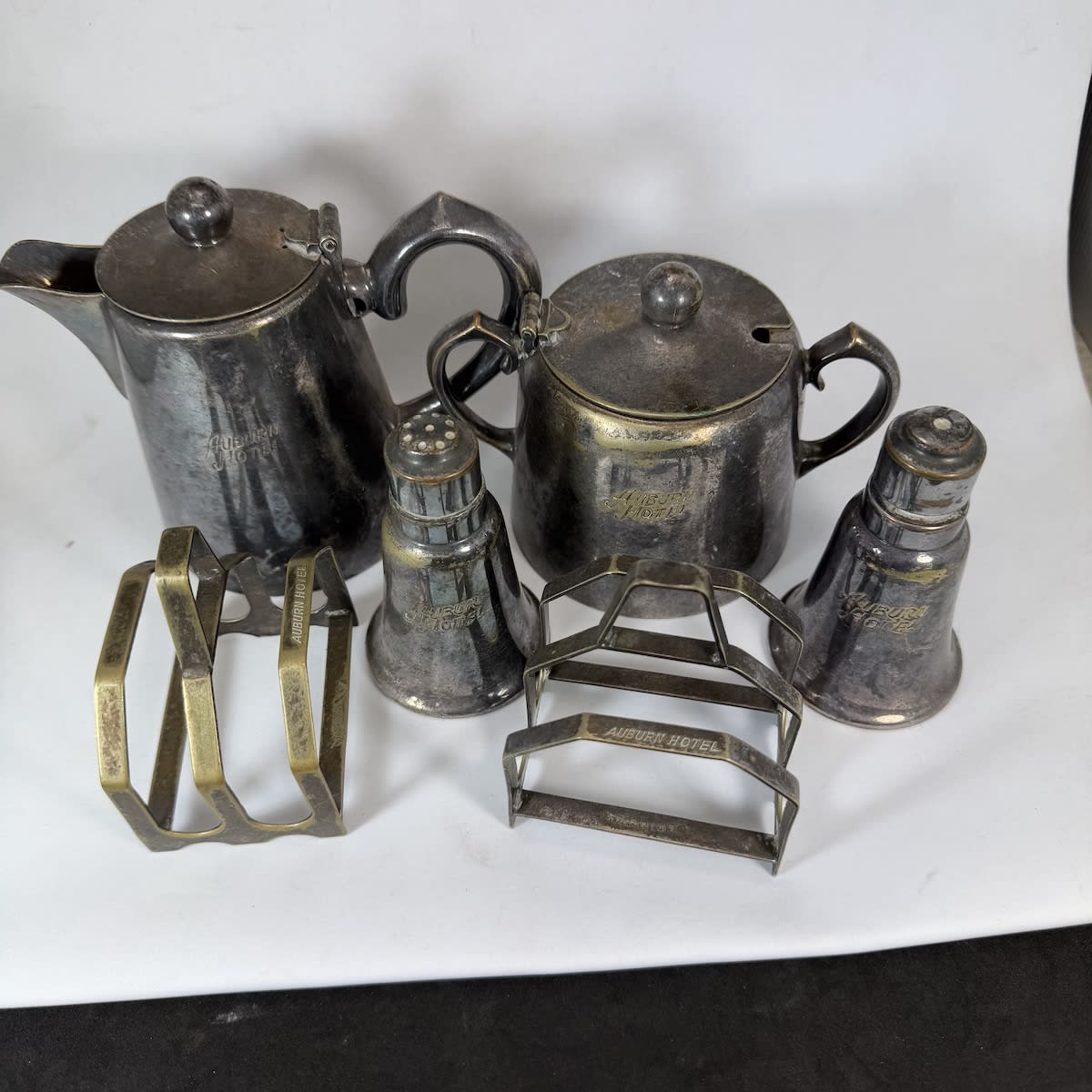 6 Plated Hotelware Items. All engrqaved for Auburn Hotel. Regal Plate. Milk Jug, Sugar Bowl, Salt & Pepper Shakers, 2 Toast Racks. (New South Wales)