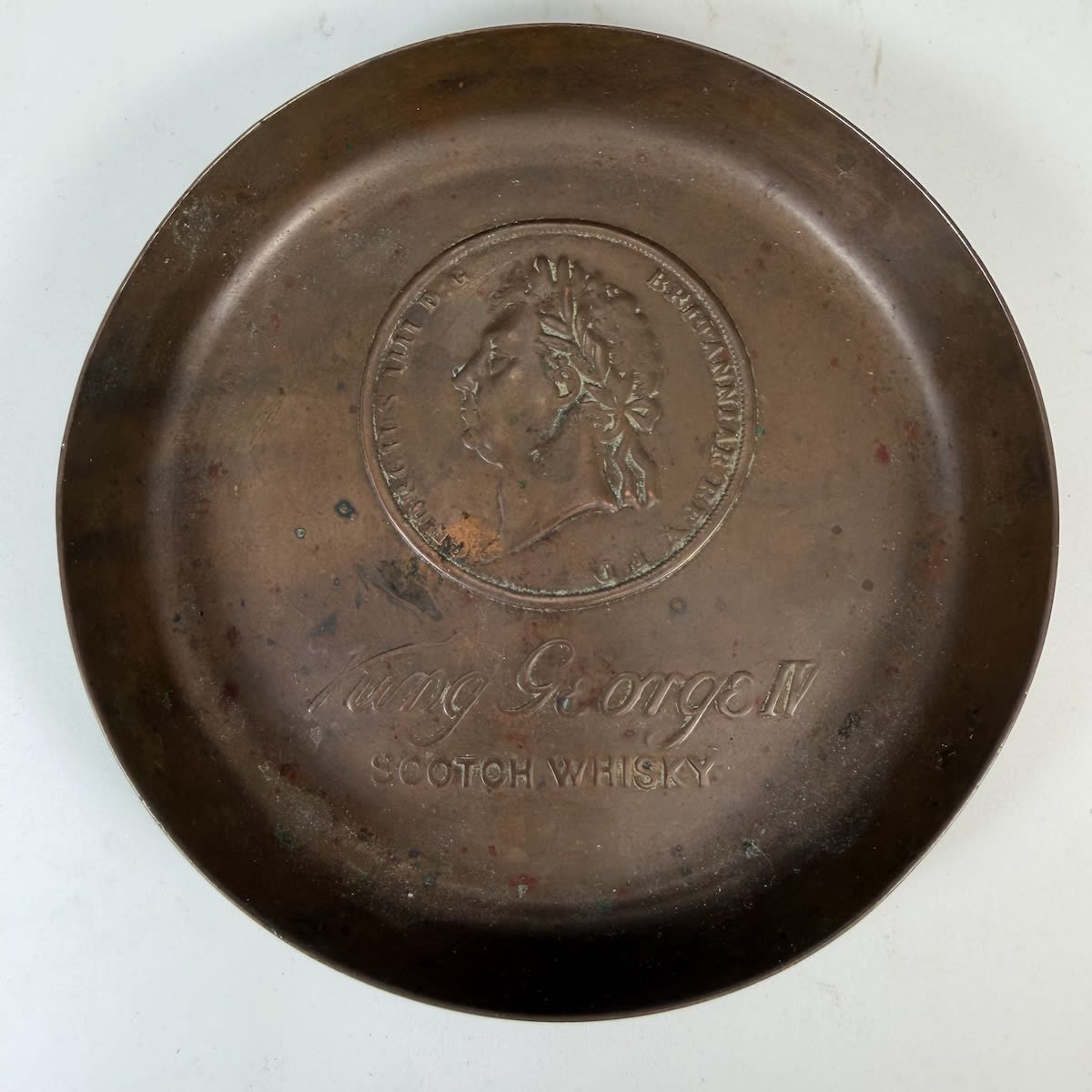 Copper Advertising Change Tray. King George IV Scotch Whisky. Coin like bust and title for King George IV.