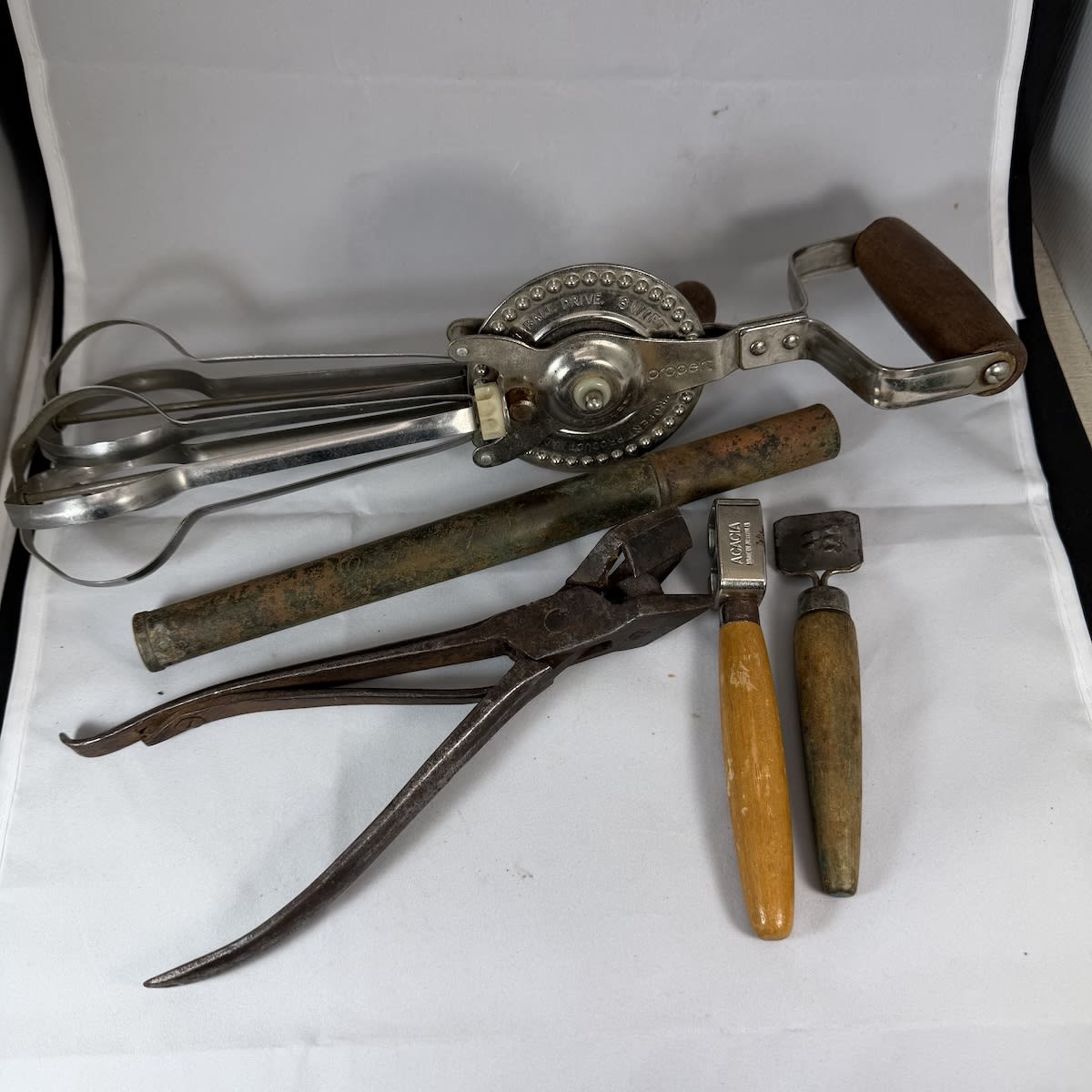 5 Tools/Implements: Early cast iron Willis & Son Makers, 31 Little Collins St West Melbourne; Property Whisk; Acacia Knife Sharpener; Little hand grater; Oceanic Tyres hand pump.