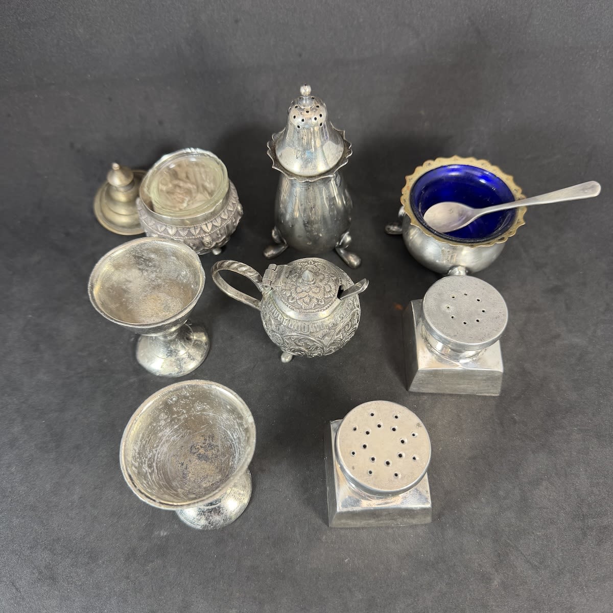 8 Small plated metal items. Salt, Pepper, Eggcups, etc.
