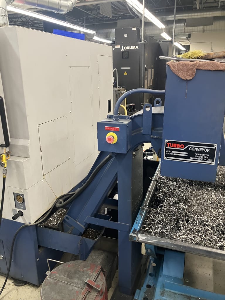 Mori_Seki_SL-204MC_2001_with_Turbo_Conveyor_Attachment.jpg