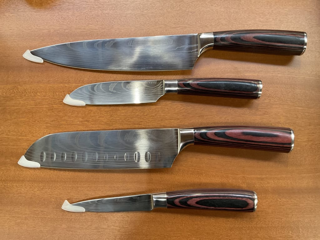 SET OF 4 KNIVES — NZ auction result