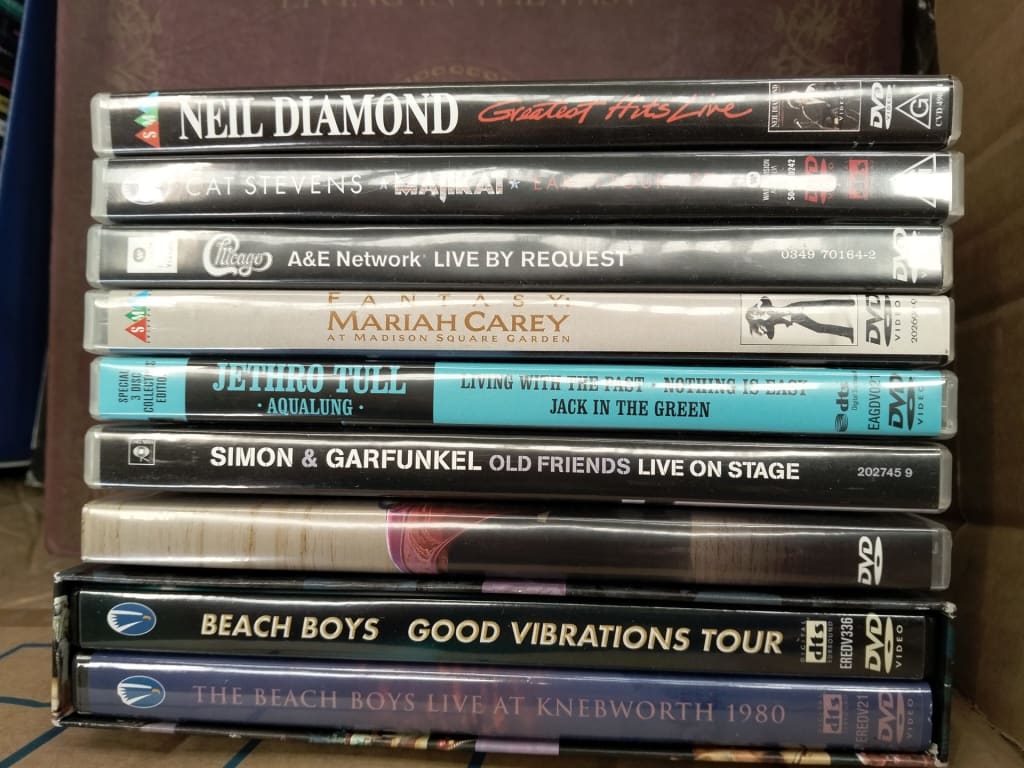 CARTON OF CDS + MUSIC DVDS AND RECORDS — NZ auction result