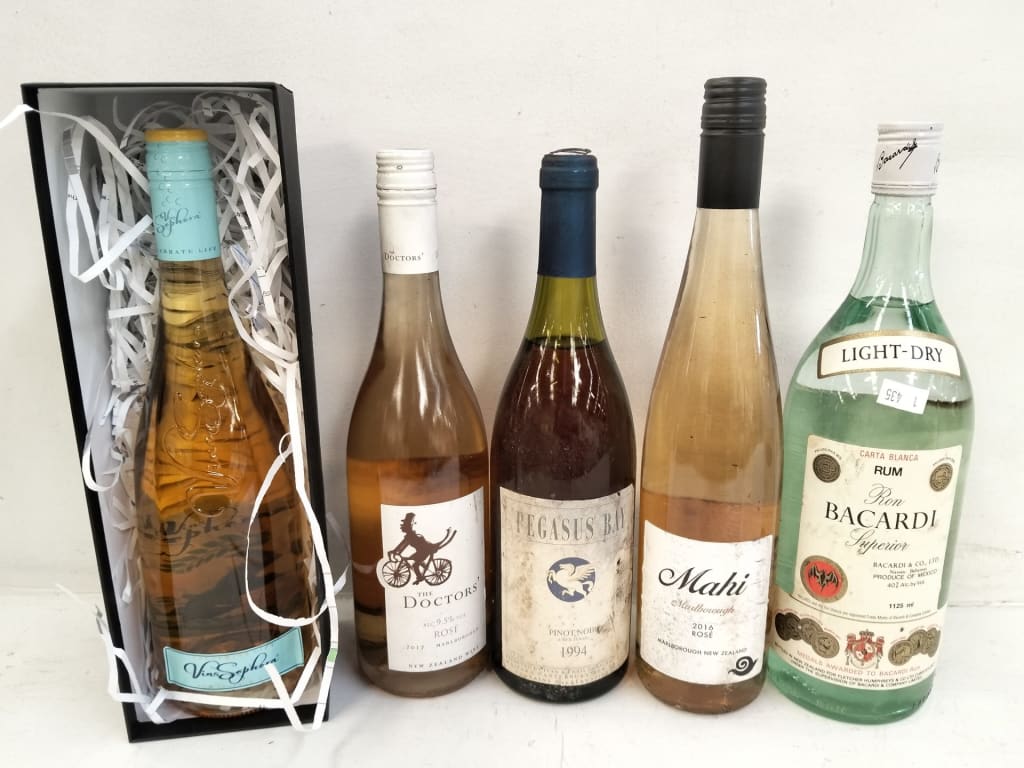 4 WINES AND 1125ML BACARDI — NZ auction result