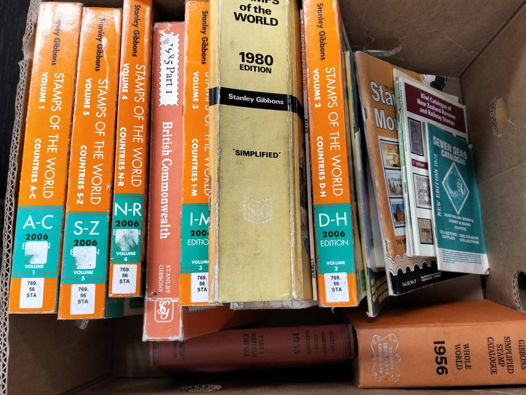 CARTON OF STAMP CATALOGUES — NZ auction result
