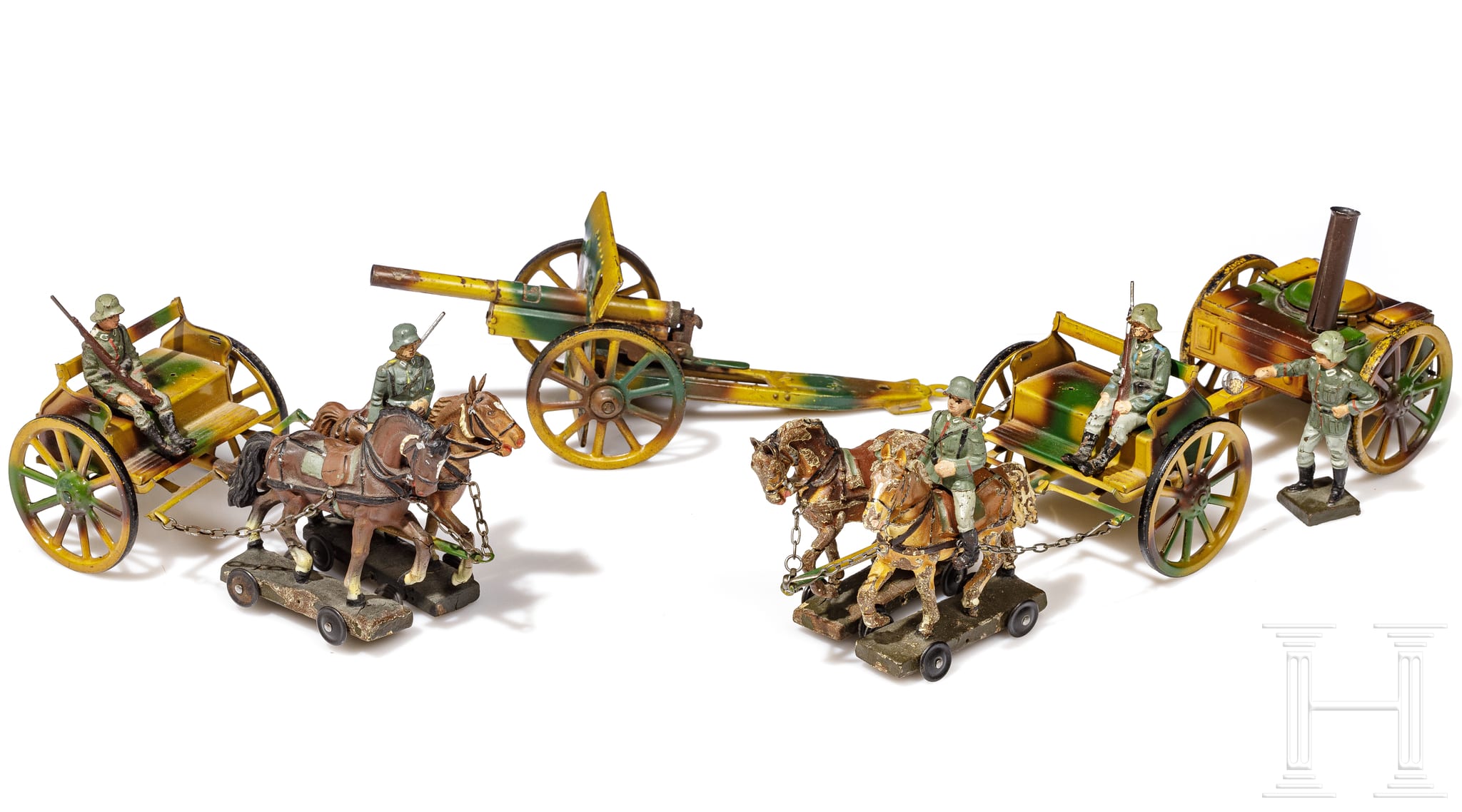 Two Lineol 7 cm horsedrawn carts with howitzer and a field kitchen